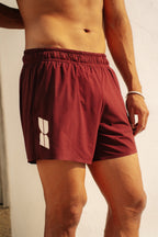 Short de running burdeos Tramuntana con malla interior de compresión y bolsillos - BILMA
